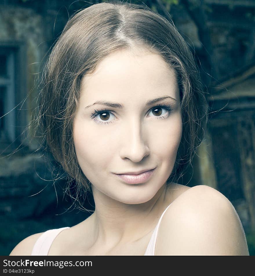 Fashion portrait of beautiful woman posing on bright background