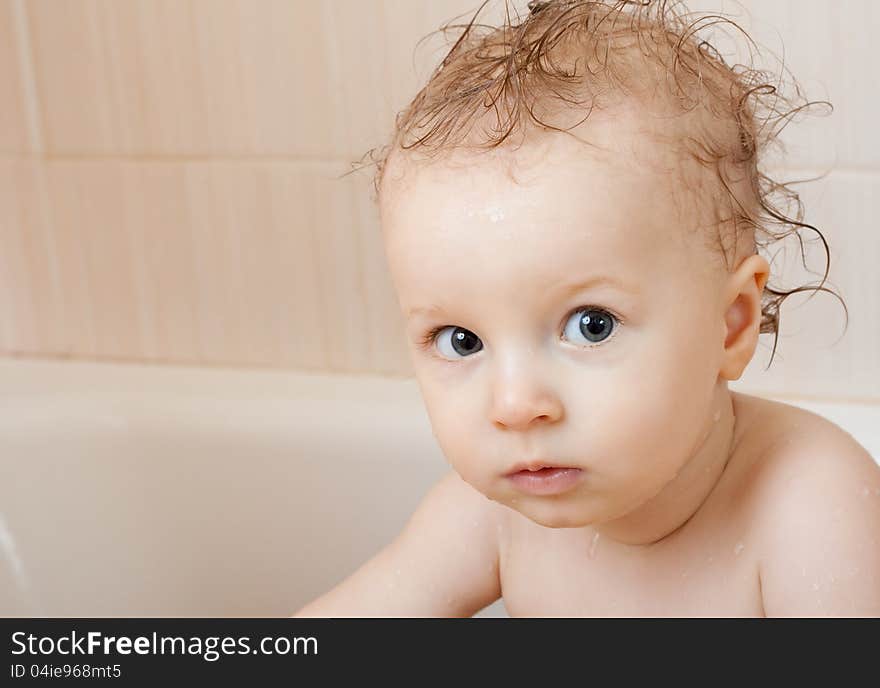 The head portrait of little boy in the bathroom