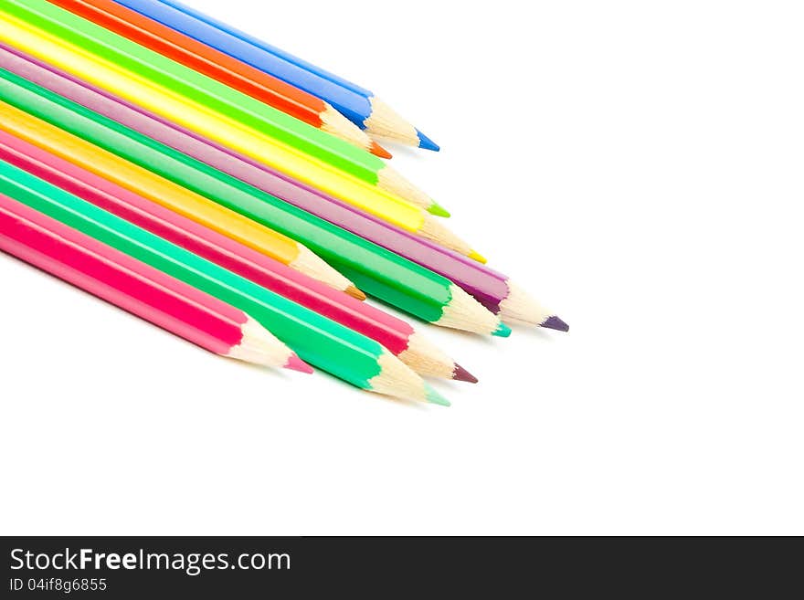 Detail of colour pencils isolated on white background with space for text. Detail of colour pencils isolated on white background with space for text