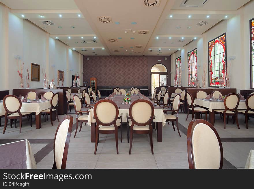 Interior of a hotel restaurant during day. Interior of a hotel restaurant during day.