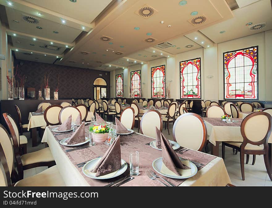 Interior of a hotel restaurant during day. Interior of a hotel restaurant during day.