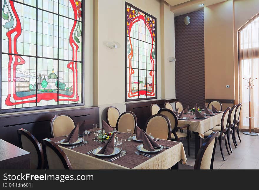 Interior of a hotel restaurant during day. Interior of a hotel restaurant during day.