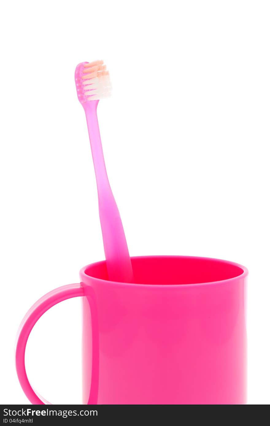 Pink toothbrush and cup