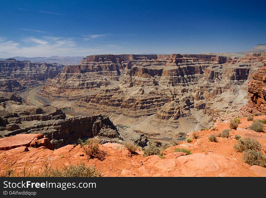 The View of the Grand Canyon from the West Rim called Guano Point with Colorado River in the background with Blue skys. The View of the Grand Canyon from the West Rim called Guano Point with Colorado River in the background with Blue skys