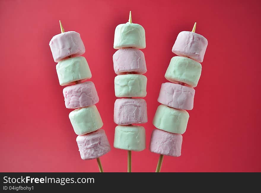 Pink and white marshmallows on skewers