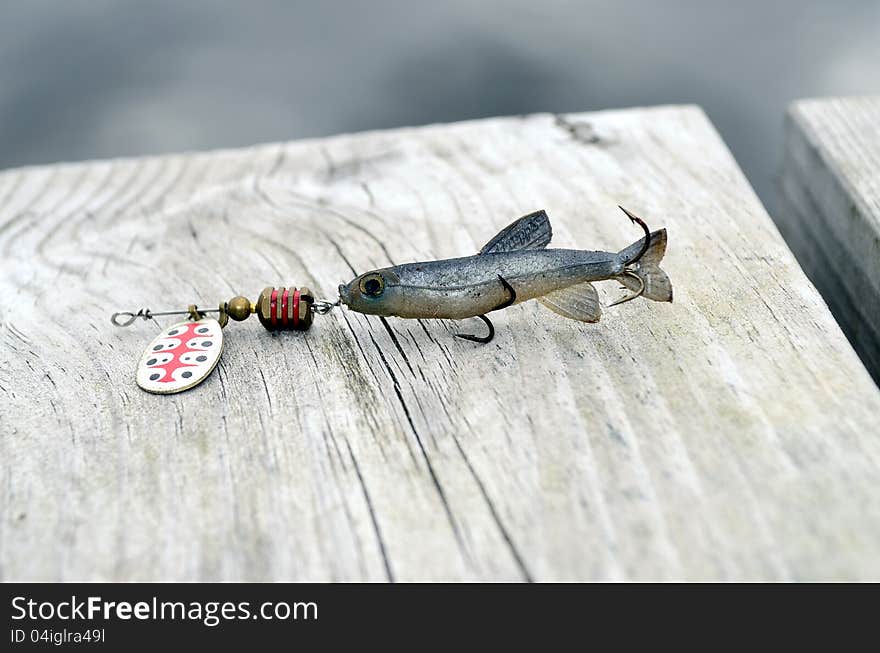 Fishing lure -floating wobbler  on a bridge