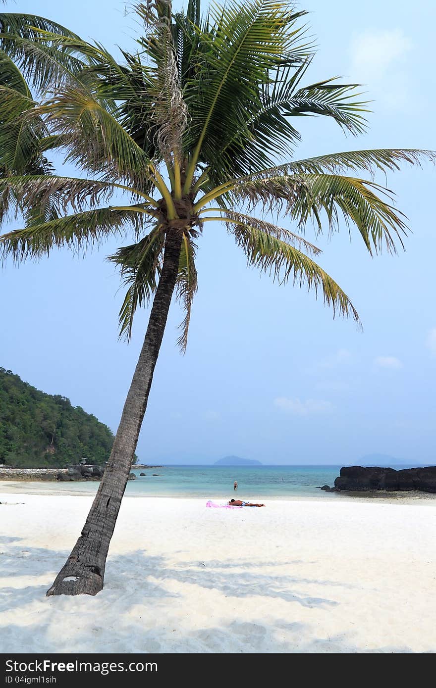 The man and the woman on a beach. The tropical island of Koh kham in the South China Sea. Kingdom Thailand