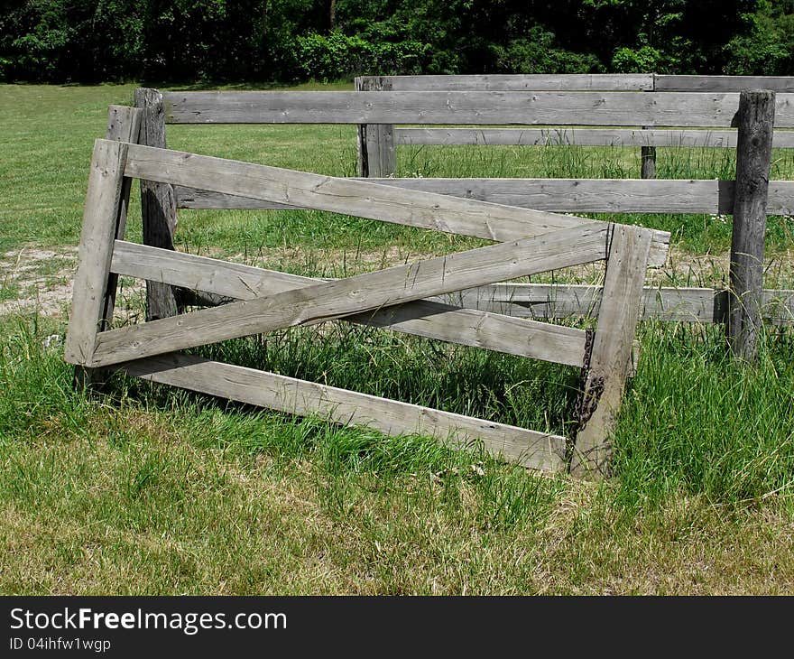 Old Gray Wood Gate In Pasture