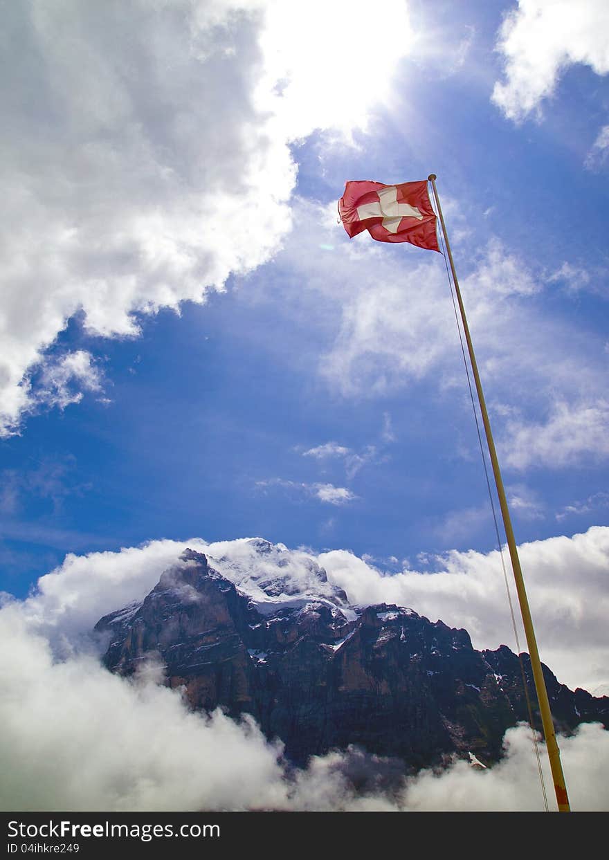 A national flag of Switzerland with Mt.Wetterhorn