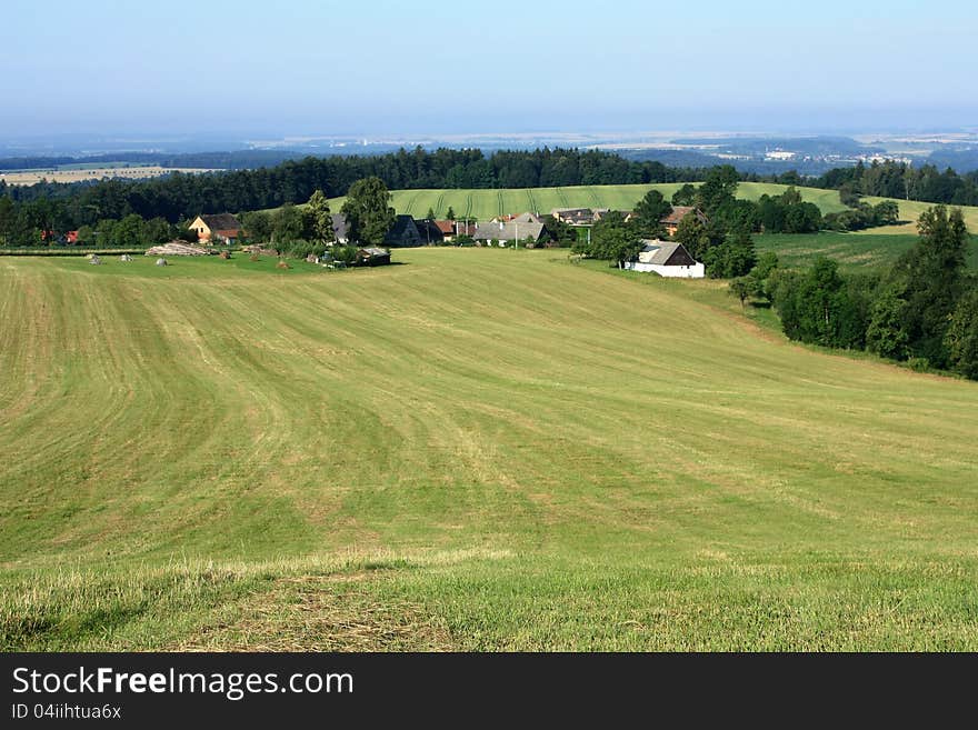 Summer landscape of the czech rural village, green fields, meadows and trees. Summer landscape of the czech rural village, green fields, meadows and trees