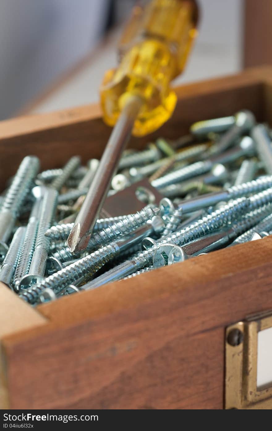 Antique wooden boxes hold various typs of small hardware. Antique wooden boxes hold various typs of small hardware