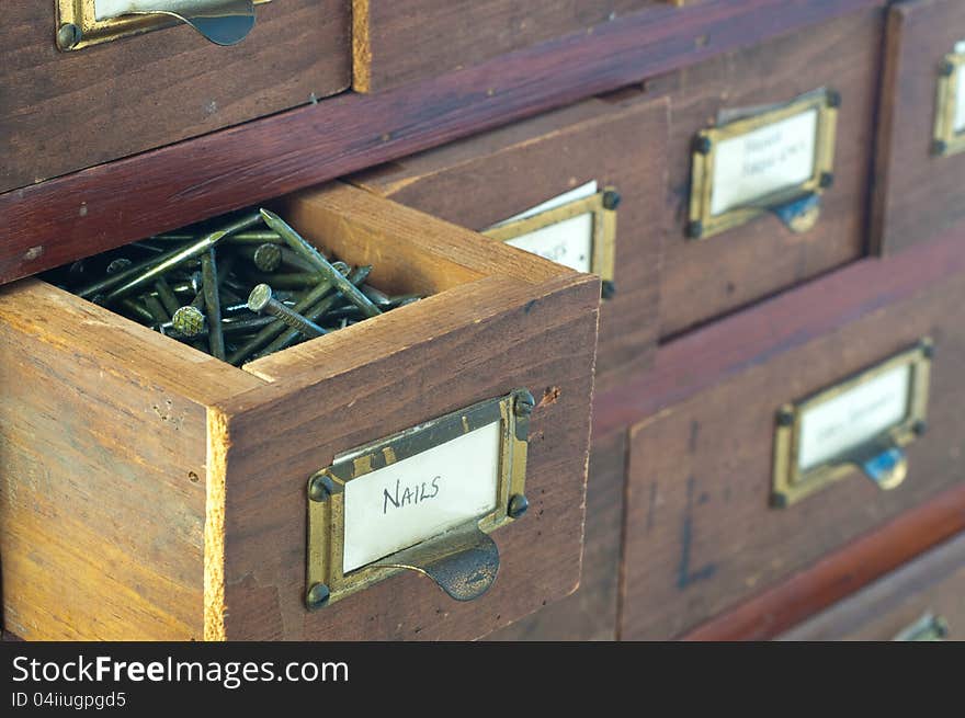 Antique wooden boxes hold various typs of small hardware. Antique wooden boxes hold various typs of small hardware