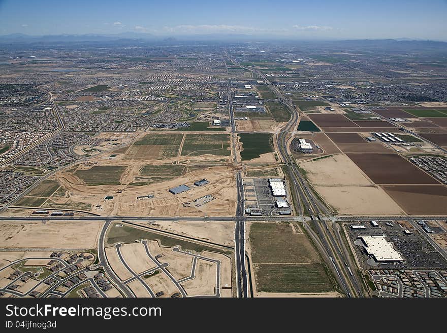 Aerial of growth and development along Interstate near Goodyear looking east towards Phoenix, Arizona. Aerial of growth and development along Interstate near Goodyear looking east towards Phoenix, Arizona