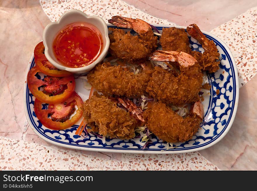 Prawns in Batter with with spicy sauce and tomatos