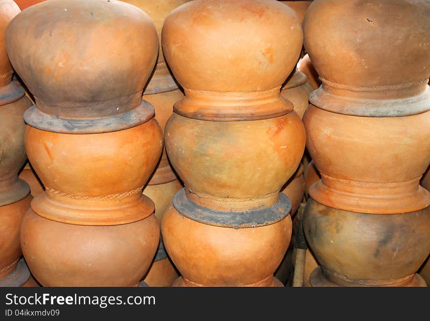 Piles of pottery clay pots in rural Thailand