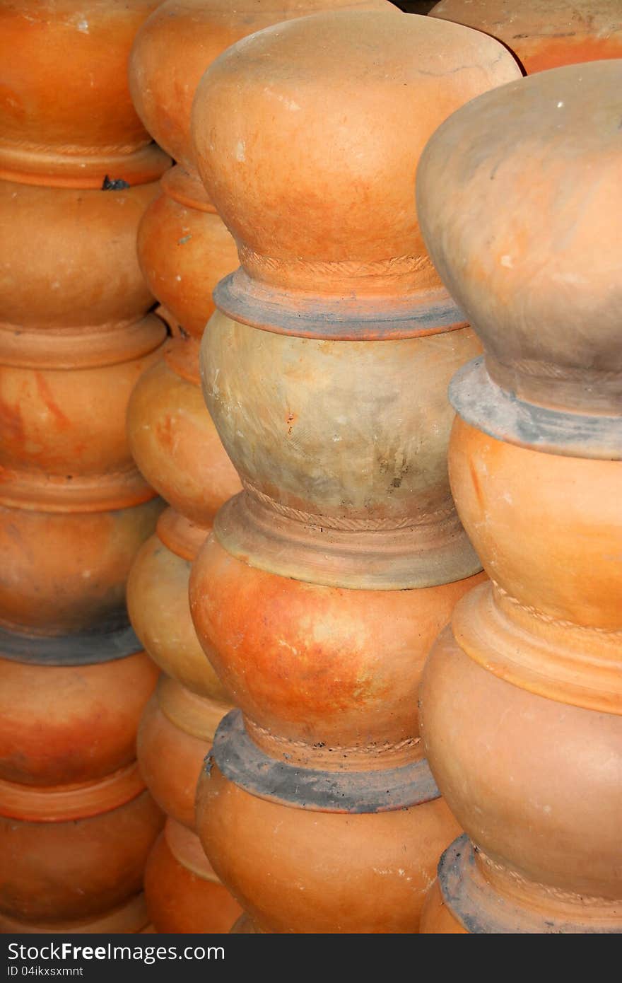 Piles of pottery clay pots in rural Thailand