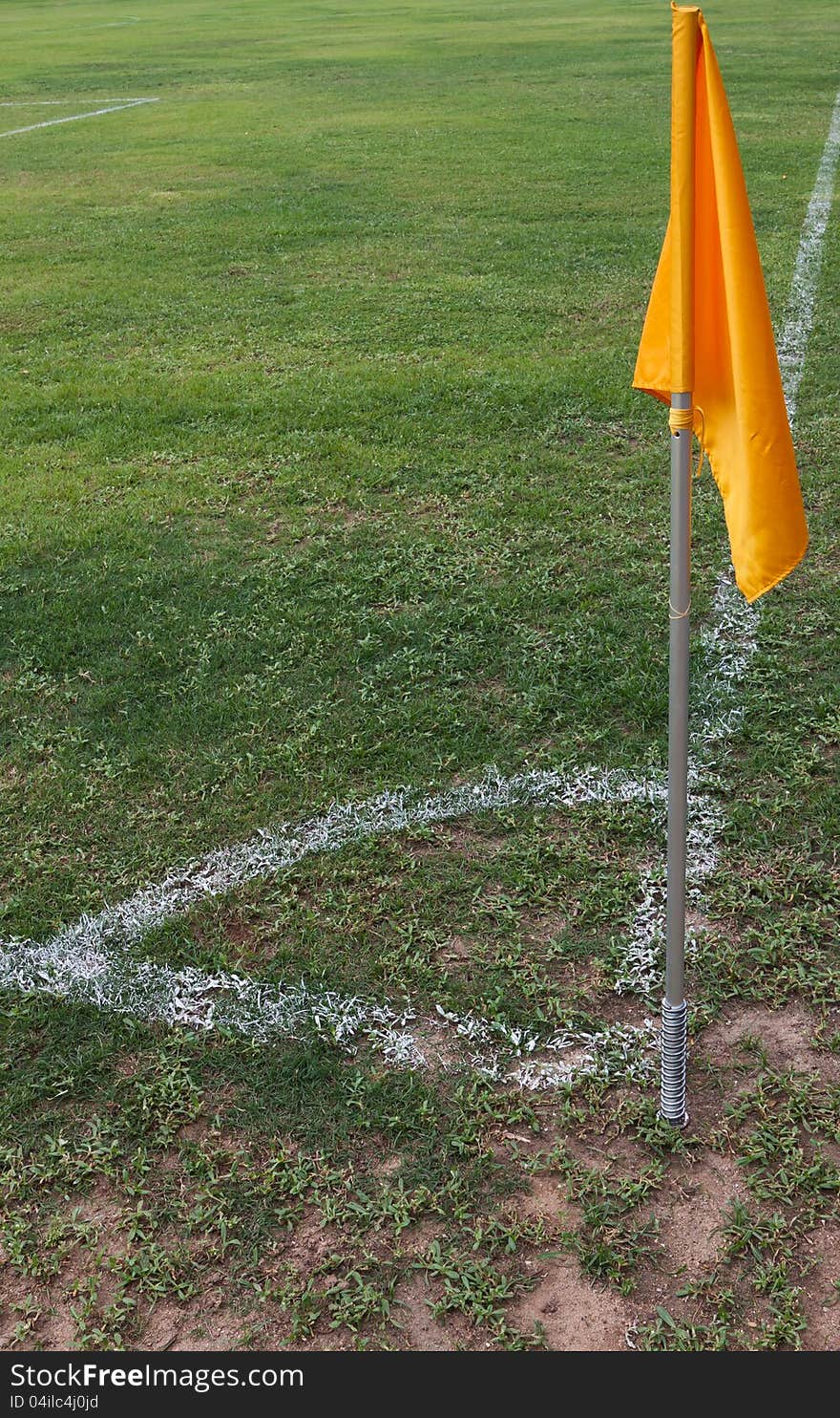 Soccer field with green grass background and yellow flag. Soccer field with green grass background and yellow flag