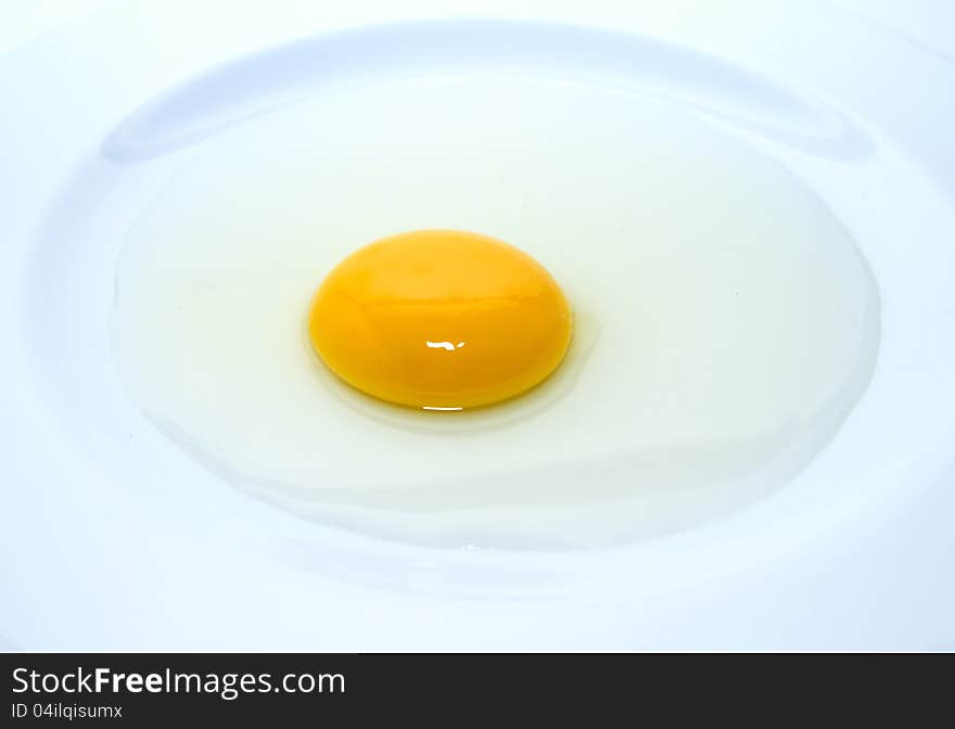 Eeg yolk in the plate prepare for cooking. Eeg yolk in the plate prepare for cooking