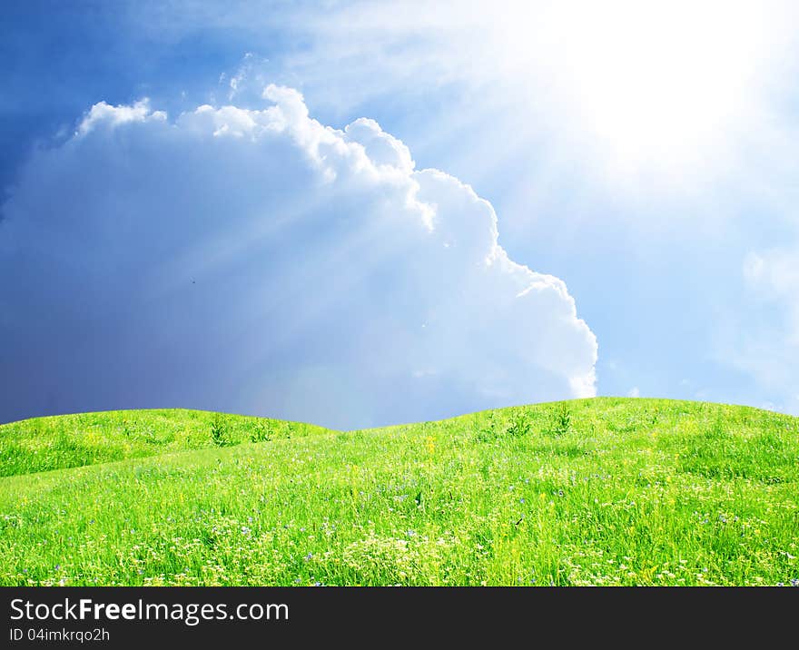 Green field,blue sky and sun