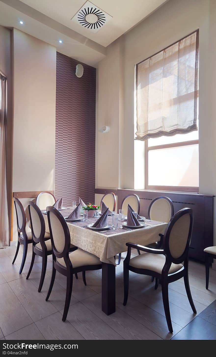 One part of a modern restaurant, table with accessories, day time. One part of a modern restaurant, table with accessories, day time.