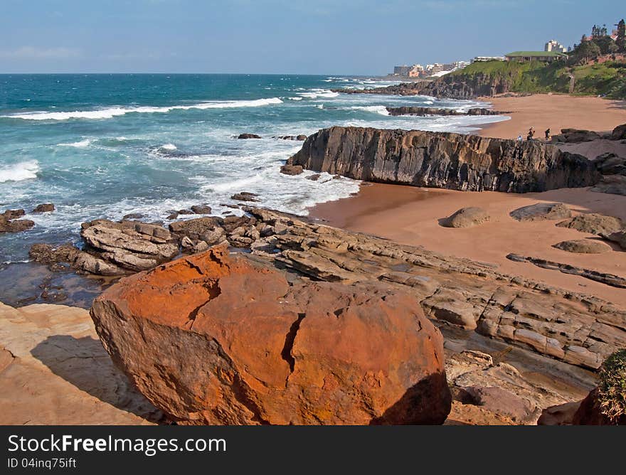 The coast line, including a secluded beach at Ballito, KwaZulu-Natal North Coast, South Africa, with holiday accommodation in the distance.