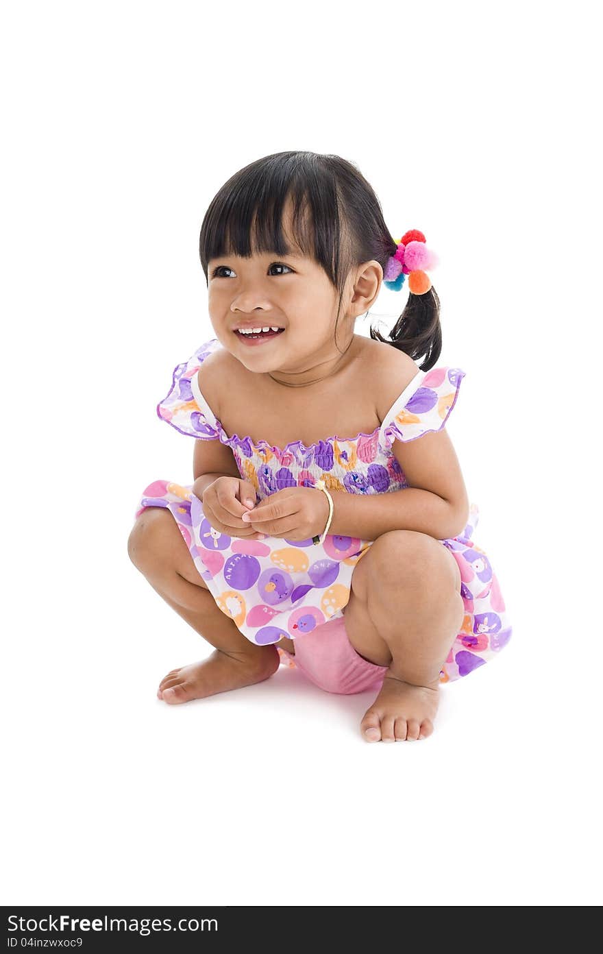 Happy little girl crouching, isolated on white background. Happy little girl crouching, isolated on white background