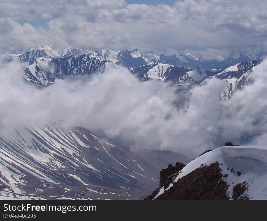 Mountain Valley shot from above the clouds Tien Shan