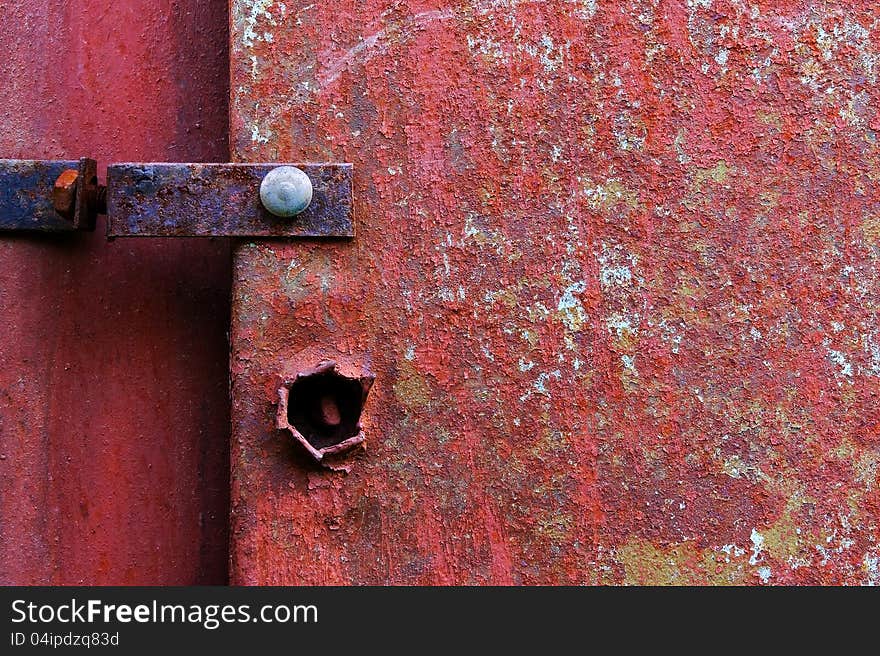 Old painted metal construction in red.