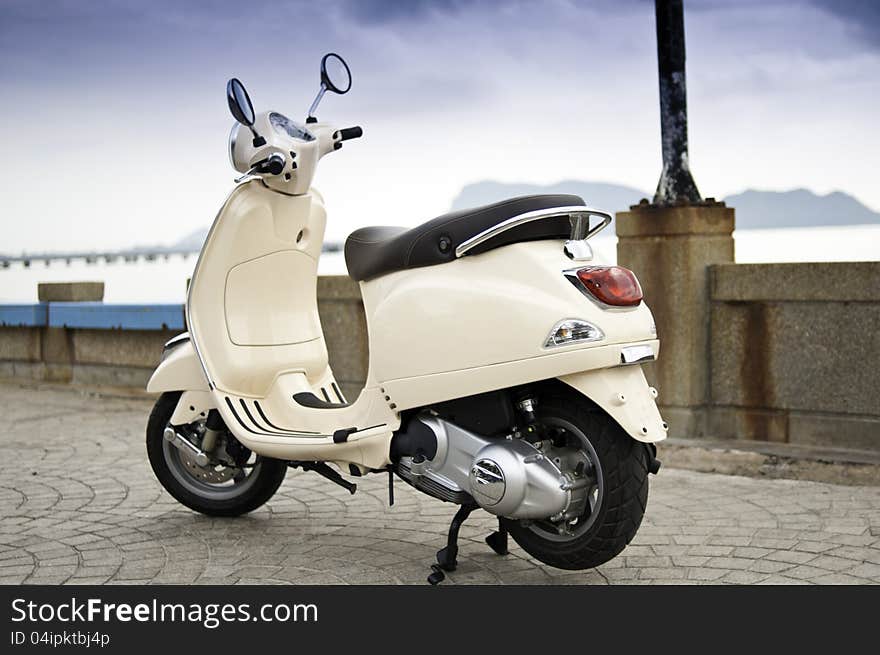 Retro style motorcycle parking by the sea. Retro style motorcycle parking by the sea