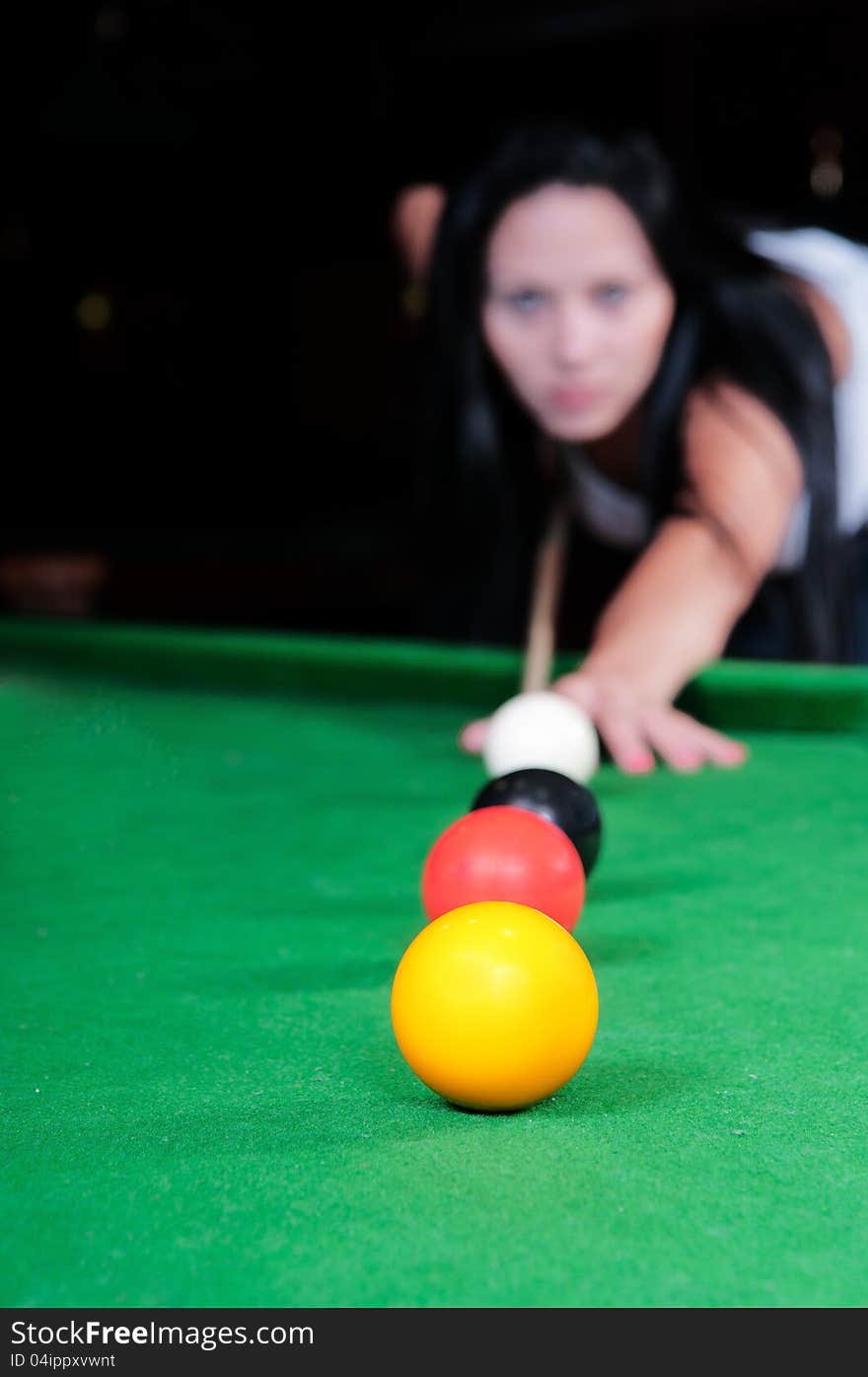 Young girl took aim and prepares to hit the ball. Young girl took aim and prepares to hit the ball