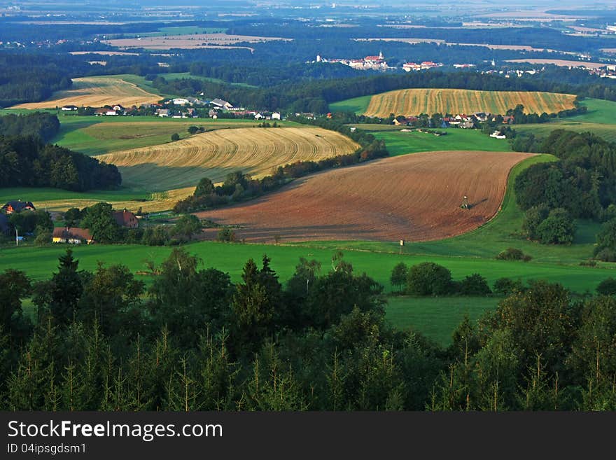 Summer landscape with fields and forests and towns. Summer landscape with fields and forests and towns