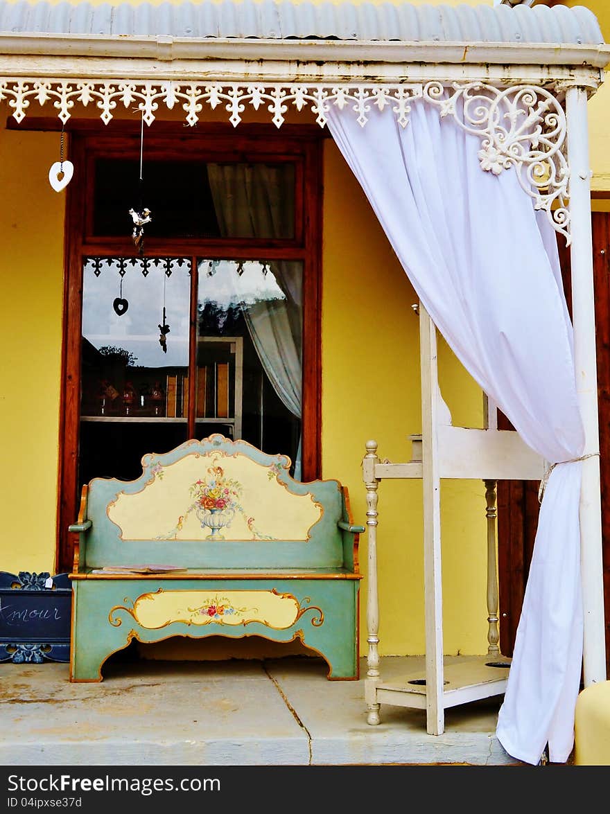 Porch of Cape Duch house with old wooden bench. Porch of Cape Duch house with old wooden bench