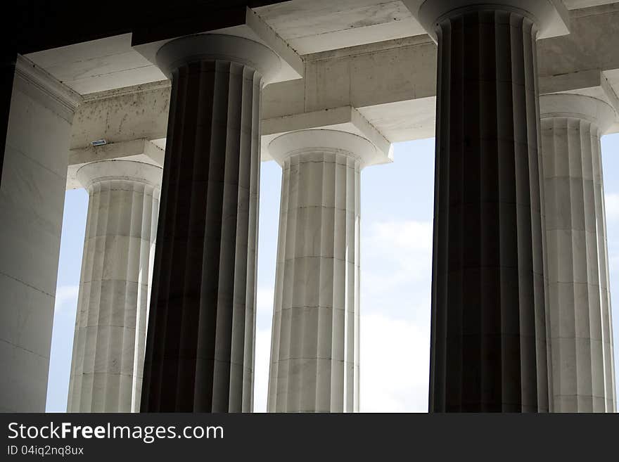 Horizontal photograph of white architectural columns