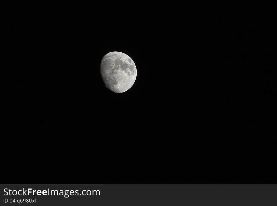 The moon against a black sky.