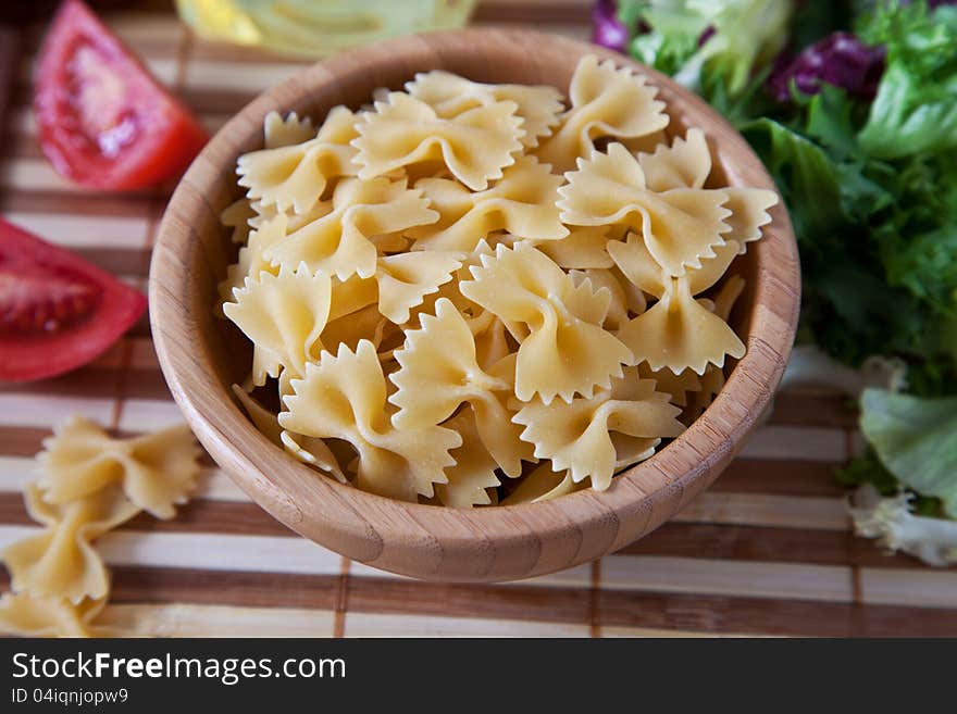 Uncooking pasta in bamboo bowl. Uncooking pasta in bamboo bowl