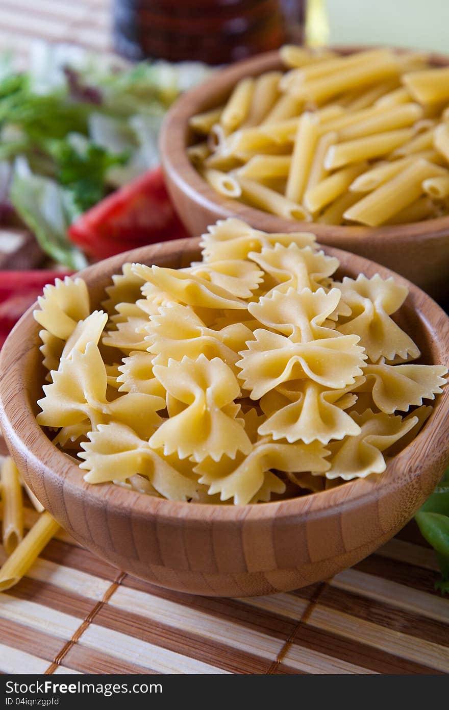 Uncooking pasta in bamboo bowls. Uncooking pasta in bamboo bowls