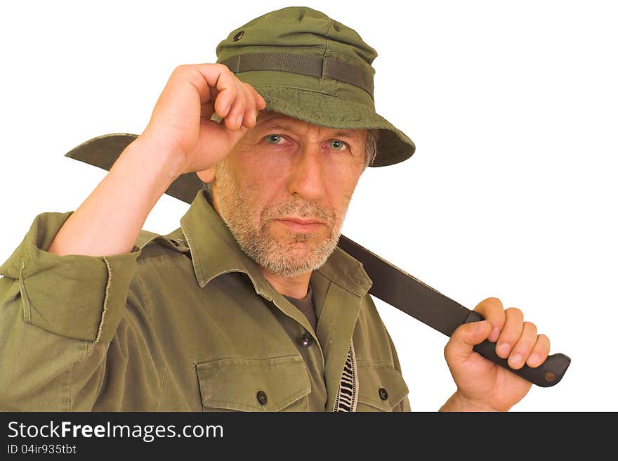 Horizontal portrait of a beardy man with a wrinkled face, wearing a green hut and a shirt. He keeps a bush knife on his back. Horizontal portrait of a beardy man with a wrinkled face, wearing a green hut and a shirt. He keeps a bush knife on his back.