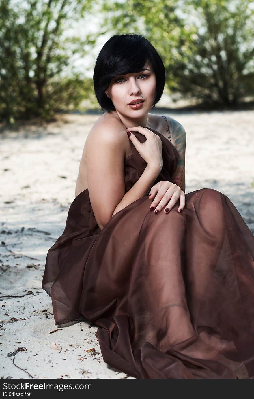 Girl posing in a tree shade