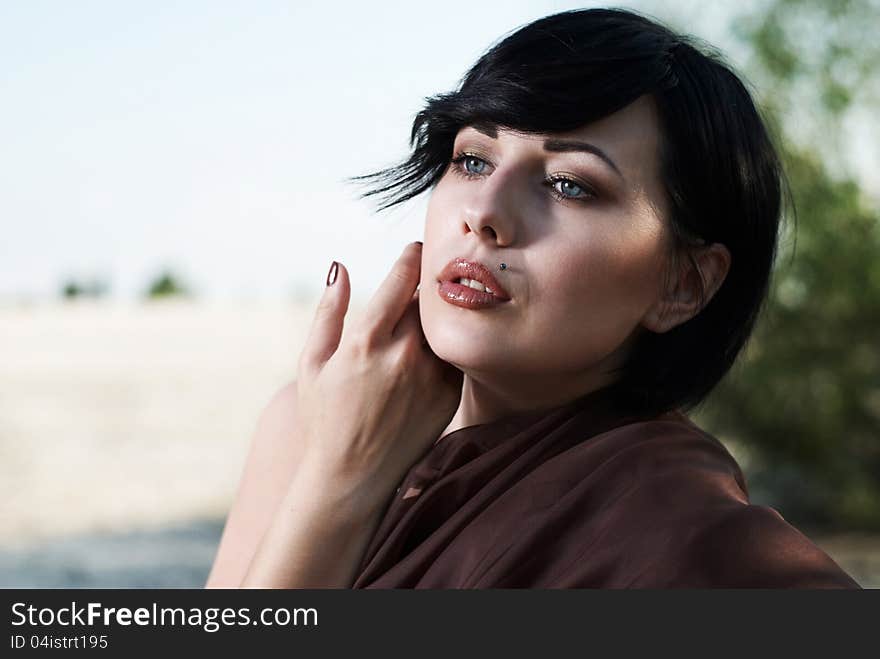 Girl posing in a tree shade