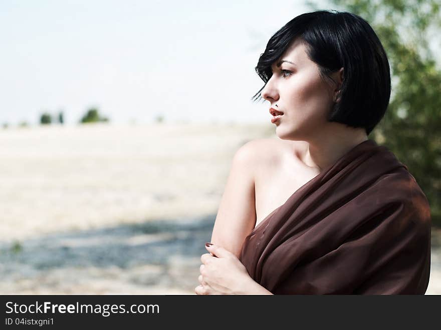 Girl posing in a tree shade