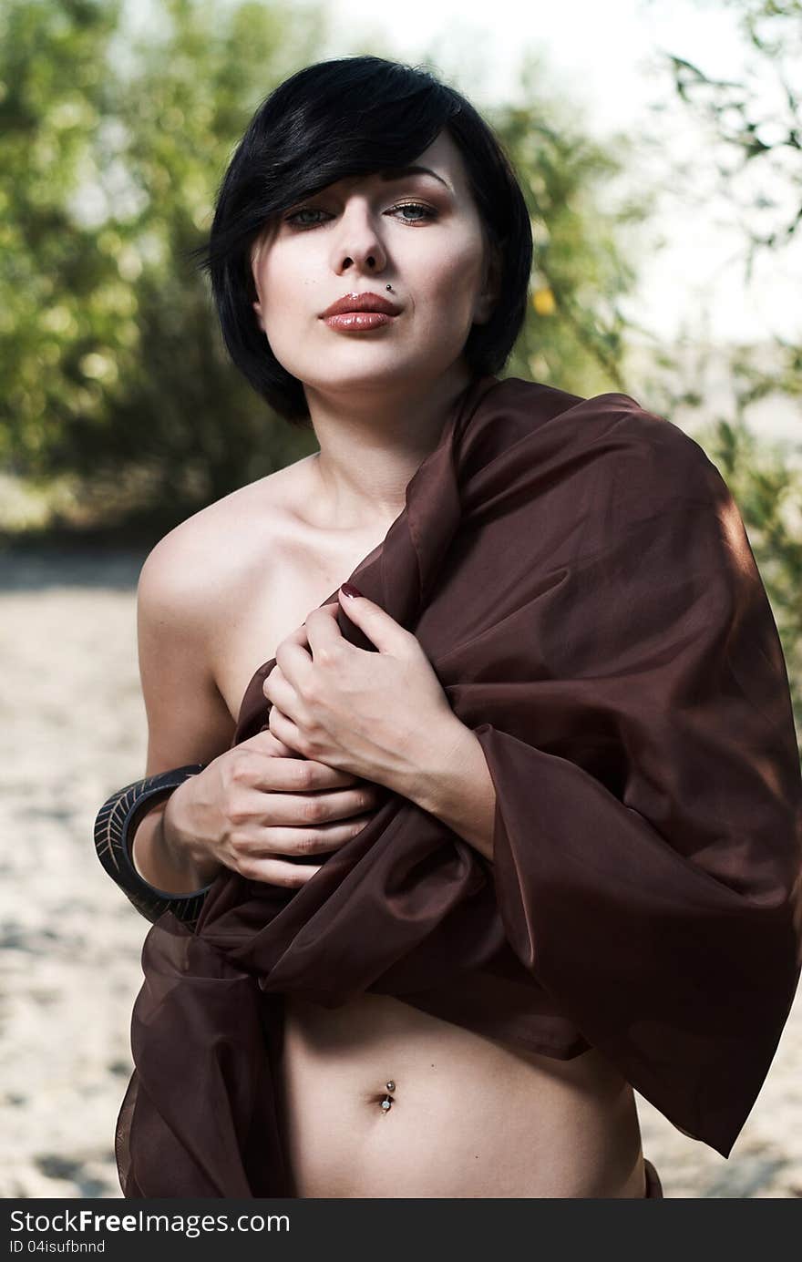 Girl posing in a tree shade