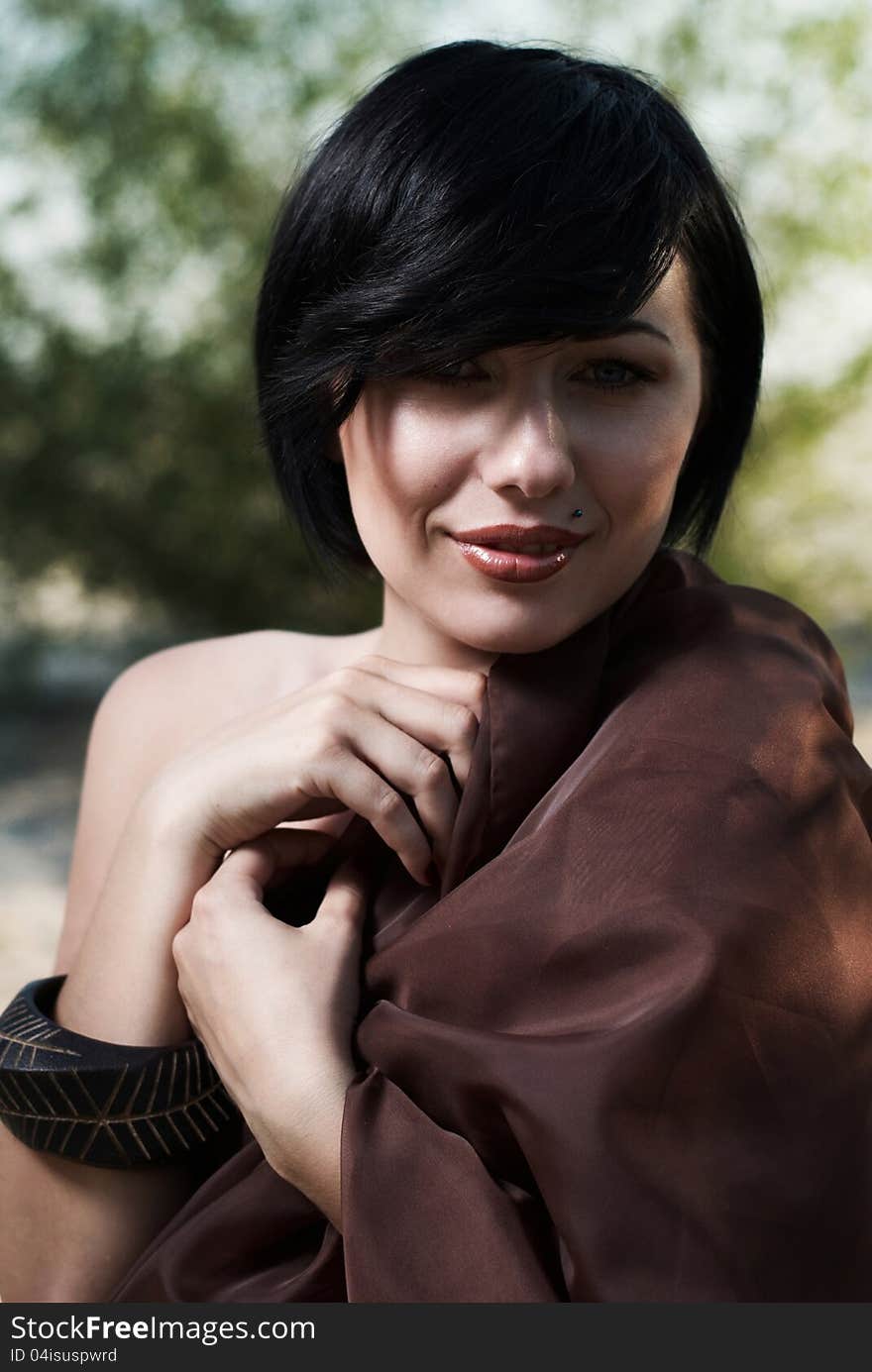 Girl posing in a tree shade