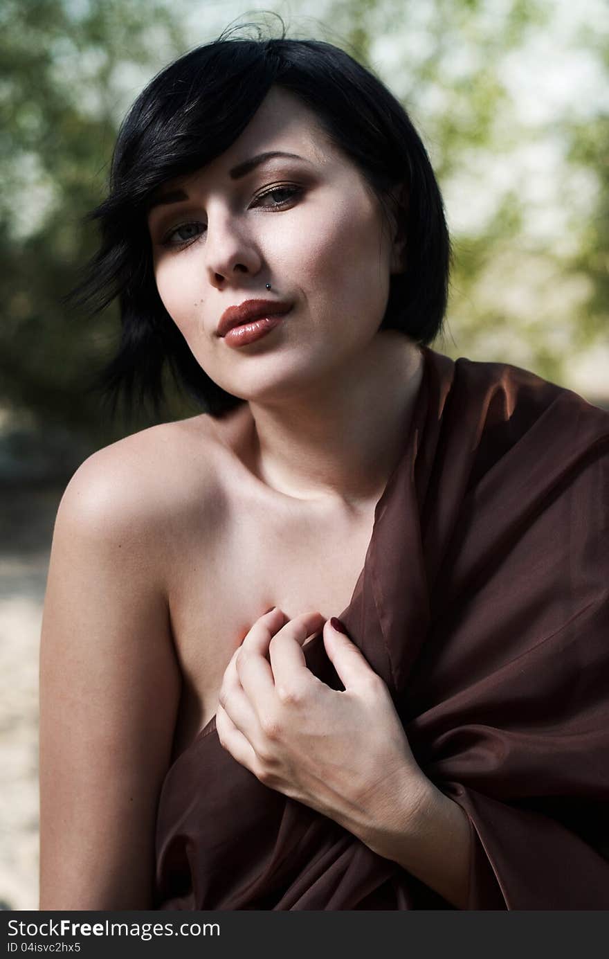 Girl posing in a tree shade