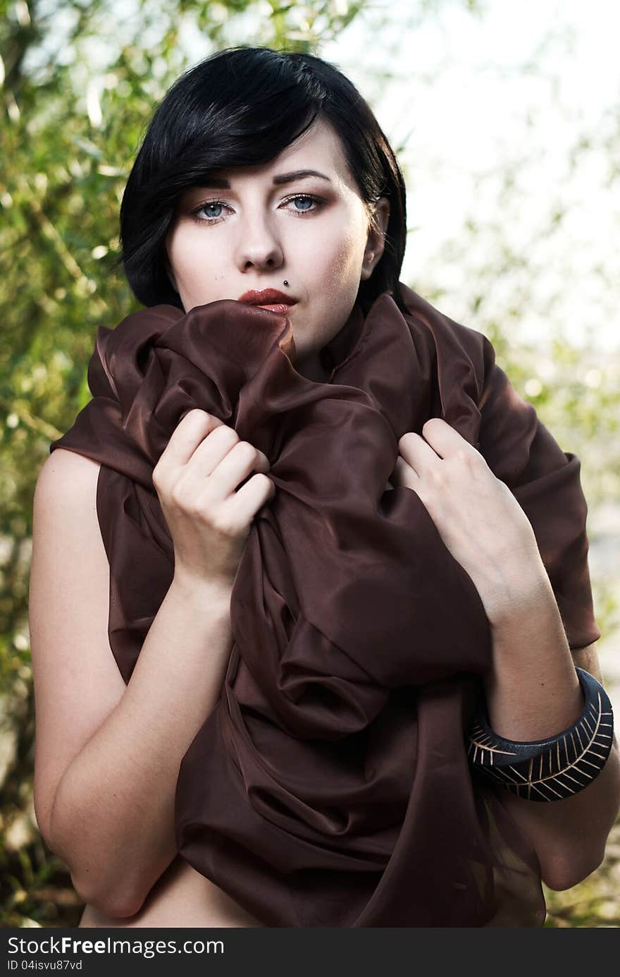 Girl posing in a tree shade