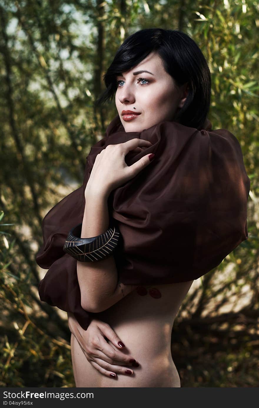 Girl posing in a tree shade