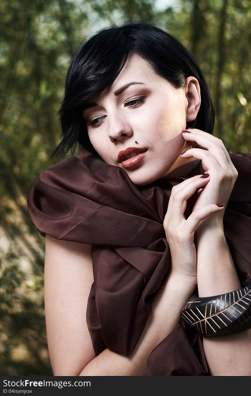 Girl posing in a tree shade