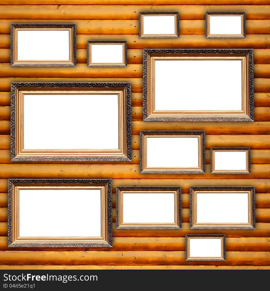 Twelve blank picture frames hanging on a wooden wall. Twelve blank picture frames hanging on a wooden wall