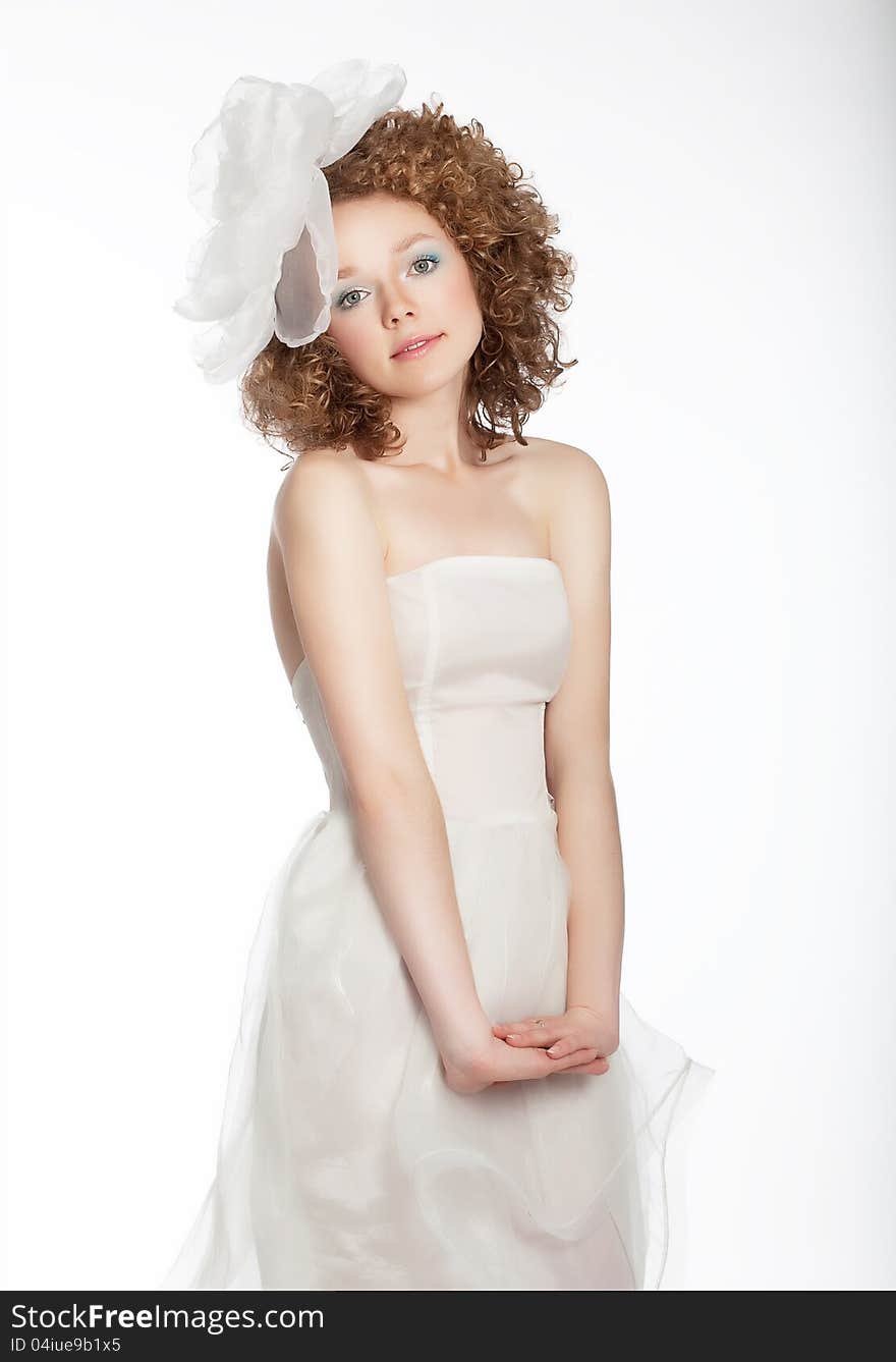 Pretty gentle happy girl in bridal dress.