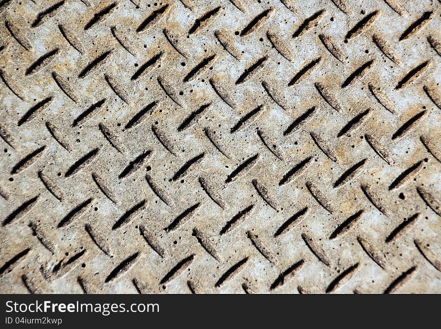 The pretty geometric pattern in this concrete street paving adds interest to the urban street scape. The pretty geometric pattern in this concrete street paving adds interest to the urban street scape.