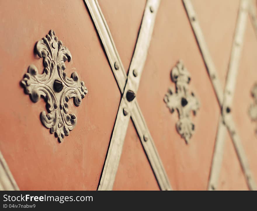 A retro style venzels with rivets decorated the ancient gate. A retro style venzels with rivets decorated the ancient gate